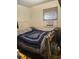Modest bedroom with a cozy quilt, window AC unit, and natural light at 612 Acapulca Way, Altamonte Springs, FL 32714