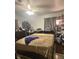 Cozy bedroom showcasing a ceiling fan, large bed, and additional storage at 612 Acapulca Way, Altamonte Springs, FL 32714
