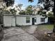 Modest one-story home featuring a front yard with sparse landscaping and an inviting walkway at 612 Acapulca Way, Altamonte Springs, FL 32714