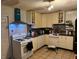 Functional kitchen features white cabinetry, modern appliances, and tile backsplash at 612 Acapulca Way, Altamonte Springs, FL 32714