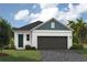 Charming one-story home features a 2-car garage, neatly landscaped yard, and covered entry at 6237 Sw 96Th Pl, Ocala, FL 34476