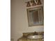 Bathroom featuring vanity with decorative cabinet and granite countertop and a framed mirror at 665 Oak Harbour Dr # 115, Altamonte Springs, FL 32701