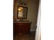 Bathroom with ornate vanity, granite countertop, decorative mirror, and tile flooring at 665 Oak Harbour Dr # 115, Altamonte Springs, FL 32701