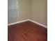 Cozy bedroom features cherry wood floors and a bright window at 665 Oak Harbour Dr # 115, Altamonte Springs, FL 32701