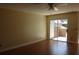 Spacious living room with hardwood floors and a sliding glass door to the outside patio, offering natural light at 665 Oak Harbour Dr # 115, Altamonte Springs, FL 32701