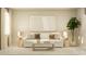 Bright living area with stylish decor, featuring a comfortable sofa, neutral tones, and modern artwork at 2607 Skyline Loop, Kissimmee, FL 34758