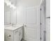Well-lit bathroom showcasing vanity with sink, storage, and modern fixtures at 5950 Bristle Oak St, Mount Dora, FL 32757