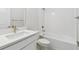 Bright bathroom featuring a tub/shower combo, modern fixtures, and tile at 5950 Bristle Oak St, Mount Dora, FL 32757