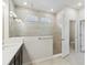 Bathroom features a glass shower and tile walls and floors at 5950 Bristle Oak St, Mount Dora, FL 32757