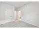Bright bedroom features neutral carpet, fresh paint, and a classic interior door at 5950 Bristle Oak St, Mount Dora, FL 32757