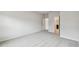 Spacious bedroom features neutral walls and carpet and an entryway to the ensuite bathroom at 5950 Bristle Oak St, Mount Dora, FL 32757