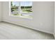 Bright bedroom featuring neutral carpet, natural light from the window, and freshly painted walls at 5950 Bristle Oak St, Mount Dora, FL 32757