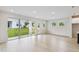 Bright living room with sliding glass doors providing ample natural light and backyard views at 5950 Bristle Oak St, Mount Dora, FL 32757