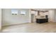 Spacious living area with open layout and a modern kitchen featuring a large island at 5950 Bristle Oak St, Mount Dora, FL 32757