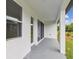 Covered patio offers a space for outdoor enjoyment and relaxation at 5950 Bristle Oak St, Mount Dora, FL 32757