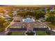 Aerial view of the community pool area and surrounding neighborhood at sunset at 6192 Sw 97Th St, Ocala, FL 34476