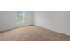 Bedroom featuring neutral carpet and a large window with a view of the water at 639 Gila Dr, Poinciana, FL 34759