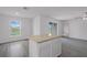 Kitchen featuring an island, wood-look flooring, and a view of the water at 639 Gila Dr, Poinciana, FL 34759
