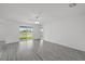 Bright living room with sliding doors that open to a view of the water at 639 Gila Dr, Poinciana, FL 34759