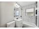 Bright bathroom showcasing tile work, modern vanity, and updated showerhead at 1037 Waynesville Ave, Lakeland, FL 33801