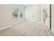 Spacious bedroom with plush carpet, double windows, and a closet, offering ample storage at 214 E Harding St, Orlando, FL 32806
