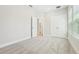 Bright, carpeted bedroom with ensuite access and closet at 214 E Harding St, Orlando, FL 32806