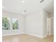 Bedroom featuring wood-look flooring and view to exterior at 214 E Harding St, Orlando, FL 32806