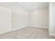 Neutral bedroom with carpet, large windows, and a minimalist design for versatile decor at 214 E Harding St, Orlando, FL 32806