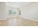 Bright bedroom with hardwood floors, recessed lighting, and natural light at 214 E Harding St, Orlando, FL 32806