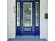 Close-up of a stylish front door featuring sidelights and a modern design, number '214' on the wall at 214 E Harding St, Orlando, FL 32806