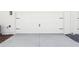 View of white garage door with decorative black hardware at 214 E Harding St, Orlando, FL 32806