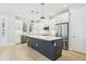 Elegant kitchen with a dark island, stainless steel appliances, and plenty of counter space at 214 E Harding St, Orlando, FL 32806