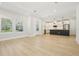 Spacious living room showcasing an open layout with plenty of natural light and modern flooring at 214 E Harding St, Orlando, FL 32806