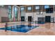 The indoor basketball and pickle ball court features a wooden floor and two hoops for active fun at 4670 Yellow Elder Way, Kissimmee, FL 34758