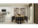 Open-concept dining area with stylish decor, seamlessly connected to a modern kitchen with barstool seating at 4670 Yellow Elder Way, Kissimmee, FL 34758