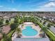 Aerial view showcasing a neighborhood pool, recreation center, and lush landscaping at 7071 Spring Park Dr, Winter Garden, FL 34787