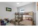 Bedroom with a bunk bed, carpet flooring and natural lighting at 7071 Spring Park Dr, Winter Garden, FL 34787