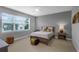 Bedroom with ceiling fan, a queen bed, natural light from the window, and carpet flooring at 7071 Spring Park Dr, Winter Garden, FL 34787
