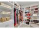 Spacious walk-in closet with built-in shelving for shoes, handbags, and hanging clothes at 7071 Spring Park Dr, Winter Garden, FL 34787