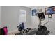 Exercise room with equipment, carpet flooring, natural lighting and grey paint at 7071 Spring Park Dr, Winter Garden, FL 34787