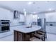 Modern kitchen featuring a large island, stainless steel appliances, and contemporary finishes at 7071 Spring Park Dr, Winter Garden, FL 34787