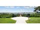 Scenic lake view with a walking pier perfect for enjoying nature and community amenities at 7071 Spring Park Dr, Winter Garden, FL 34787