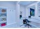 Bright office space with a corner desk, ample workspace, and custom shelving at 7071 Spring Park Dr, Winter Garden, FL 34787