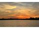 Beautiful sunset over the lake offers a tranquil and serene community atmosphere at 7071 Spring Park Dr, Winter Garden, FL 34787