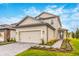Beautiful two-story home with a two car garage, tidy landscaping, and neutral color palette at 7740 Somersworth Dr, Kissimmee, FL 34747