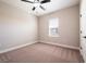 Carpeted bedroom with a ceiling fan and a bright window at 7869 Somersworth Dr, Kissimmee, FL 34747