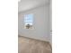 A carpeted bedroom featuring natural lighting at 385 Begonia Ct, Poinciana, FL 34759