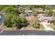 Aerial view of the property showcasing its mature trees and neighborhood surroundings at 132 Margate Mews, Longwood, FL 32779
