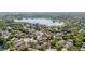 Aerial view of the property in its community, near a beautiful lake at 132 Margate Mews, Longwood, FL 32779