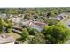 An aerial view of a home featuring a screened-in pool and a fenced backyard at 132 Margate Mews, Longwood, FL 32779